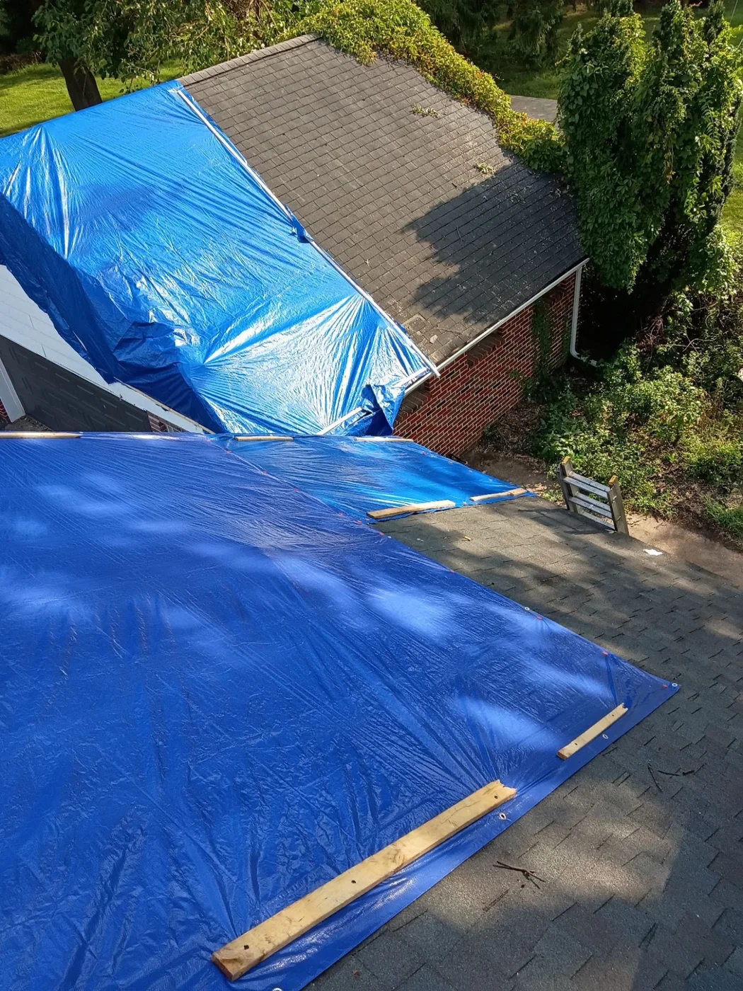Tarped sections of a residential roof