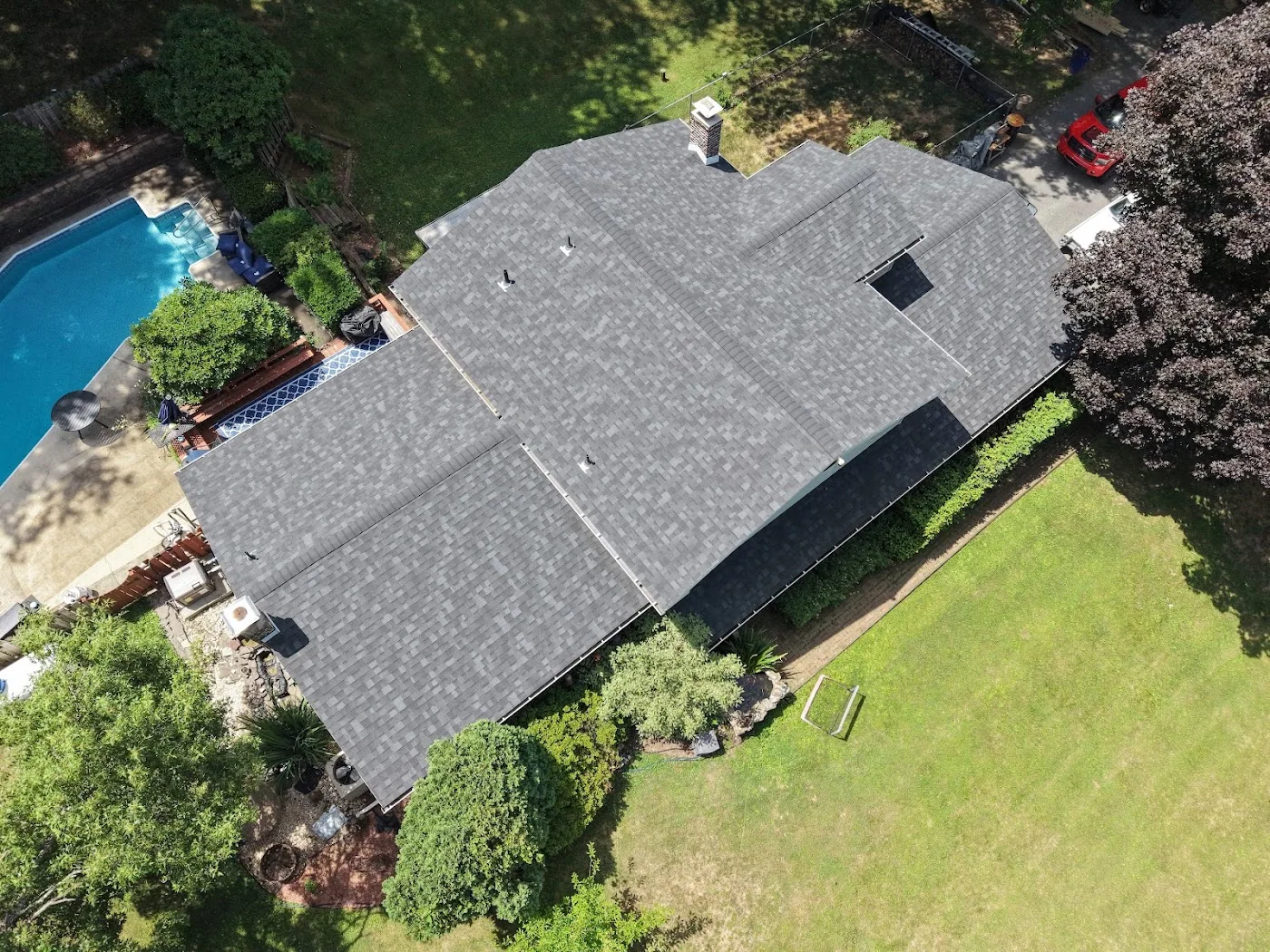 Aerial view of a house beside a swimming pool