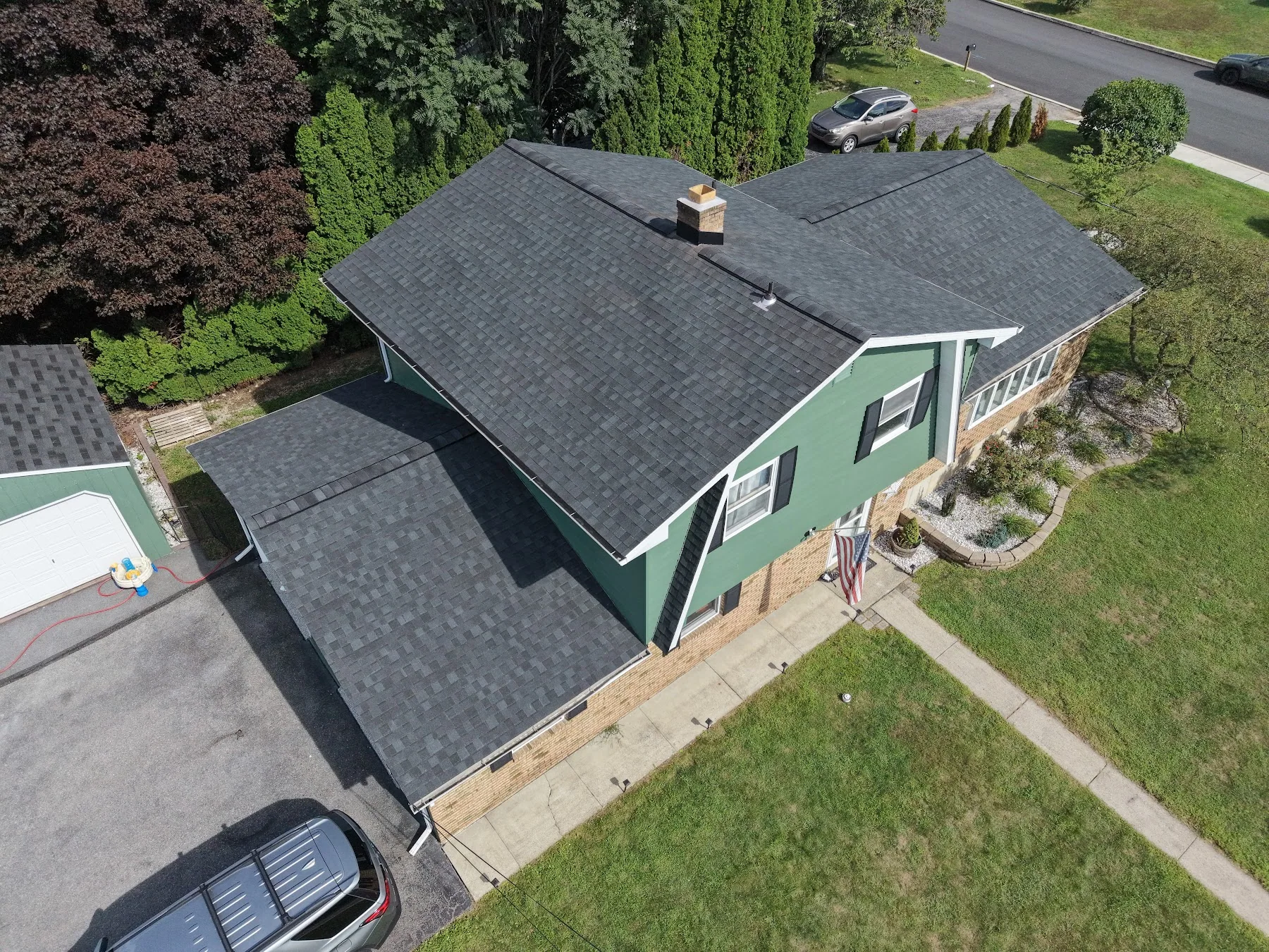New-looking roof on a green home