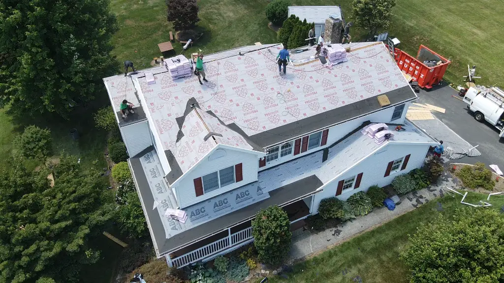 Roofing crew working on a home
